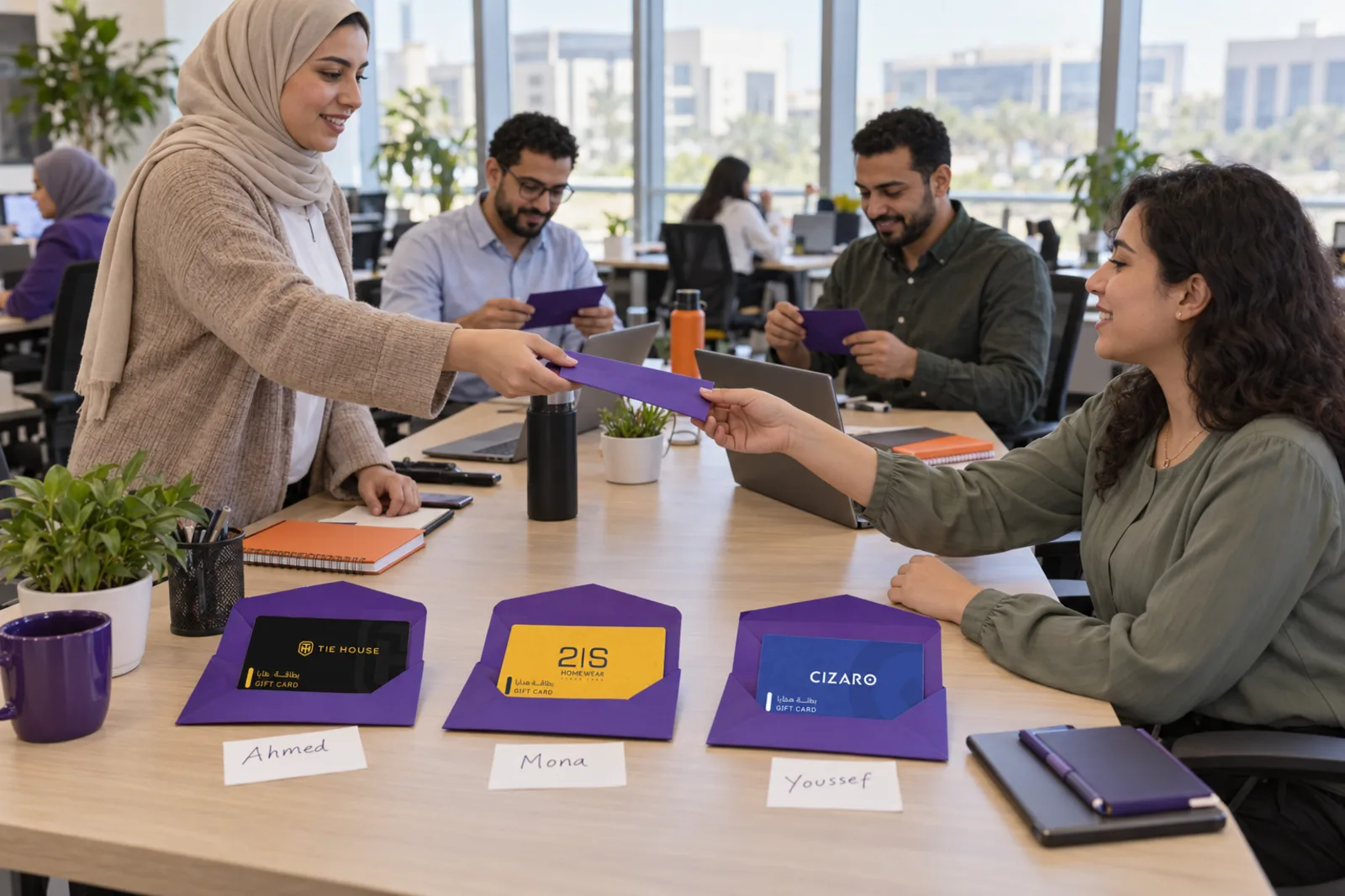 A colleague handing a gift card to a teammate